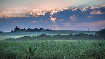 Raytraces in clouds in the countryside at the morning