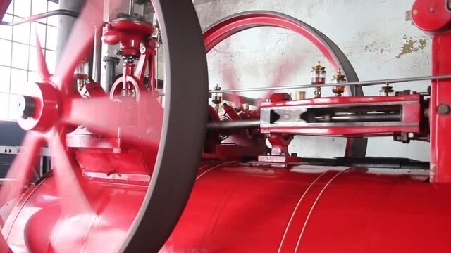 Running steam engine in an ancient factory