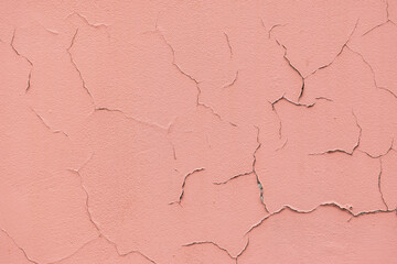Abstract grunge pink wall with cracks background with copy space
