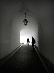 Graphic Shadow of people  silhouette in the tunnel walkway of Český Krumlov castle