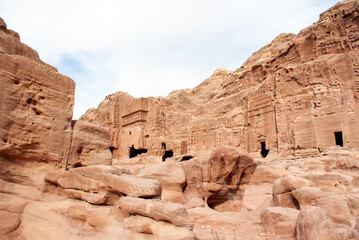 The ancient city of Petra in Jordan became one of the 7 New Wonders of the World. The city's carved rose-red sandstone rock facades, tombs, and temples. 