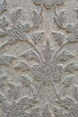 Sculptures carved floral motifs on the stone surface. that is handcrafted