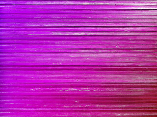 Old background of pink wooden planks board texture.