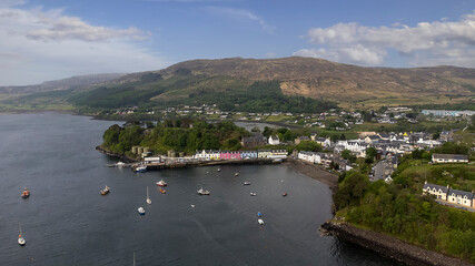 Fototapeta na wymiar The colourful houses of Portree Harbour on the Isle of Skye, Scottish Highlands, UK