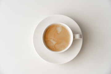 View top. cup of coffee with milk. traditional morning breakfast