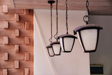 lighting for the street. lanterns are suspended on the summer terrace 