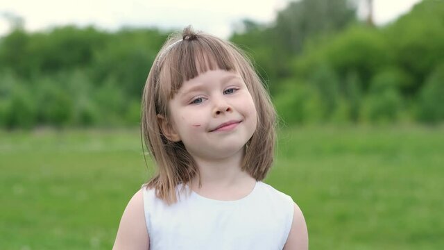 Portrait of cute girl. Girl desire happy. Close-up face of dream child. Happy child in park enjoying dream. Child desire for happy.