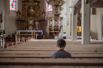 Fototapeta premium One man siting in the empty catholic church