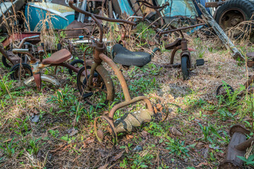 Abandoned rusty tricycles