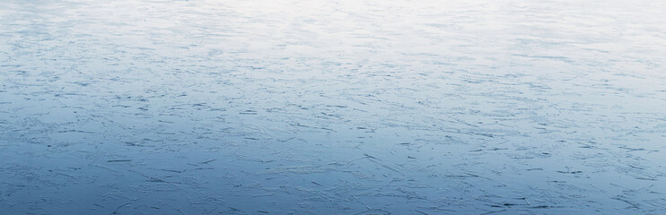 Winter background of ice on the river with a light texture, panorama