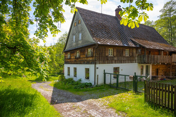 Fototapeta na wymiar Old medieval mill in rural nature country. Czech rustic architecture.