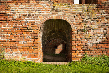 A kind of doorway downwards as seen from the outdoor area (the courtyard) of the ruin castle Teylingen.