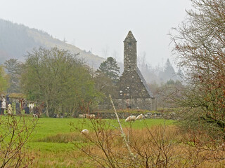 Saint Kevin Medieval church in the valley of of Glendalough on a foggy day, Dublin mountains, Wicklow county, Ireland
