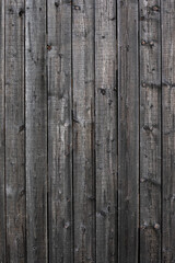 Wood wooden brown, grey with plank texture wall background. Wooden surface of the vertical boards. Background for design and presentations.