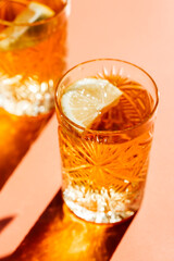 iced tea with lemon in a glass, cold drinks concept 