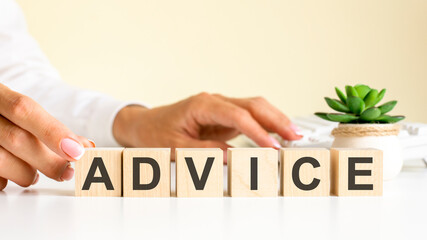 wooden blocks with letters advice on the office desk, information and communication background