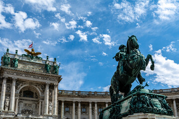 Fototapeta na wymiar Low angle view of the Statue of Prince Eugene on the Herosquare in Vienna, Austria in front of the Hofburg Palace