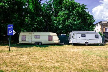 A caravan is built on the lake shore in a recreation center in the summer season