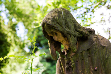 Historic Statue on the mystery old Prague Cemetery, Czech Republic