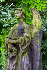 Obraz premium Historic Statue on the mystery old Prague Cemetery, Czech Republic