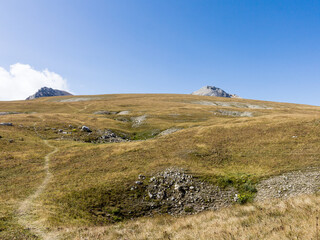 Panoramic views of the mountains from hiking trails in the mountainous area on a warm, sunny autumn day, walking and communicating with nature.