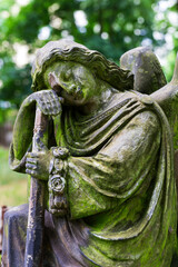 Obraz premium Historic Statue on the mystery old Prague Cemetery, Czech Republic