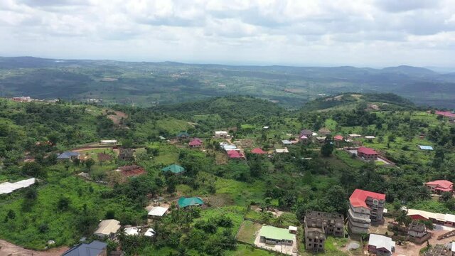 Aerial Aburi village mountain top tropical Accra Ghana. Rural forest and mountain valley tropical jungle environment. Landscape green trees scenic tropic habitat travel destination. Forest and nature.