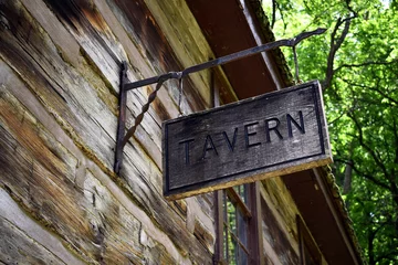 Fotobehang Wooden tavern sign hanging outside a log cabin © Ashley