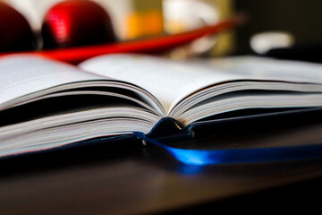 open book on a wooden table