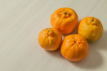 Top view of tangerines on the table with copy space. Orange, sweet and tropical citrus fruit. Fruit concept. Tangerine concept.
