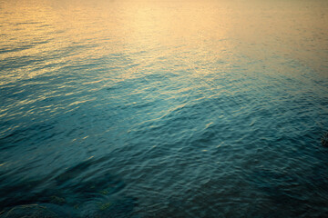 Obraz premium Top view of seawater at sunset. Abstract nature landscape background. Gradient color