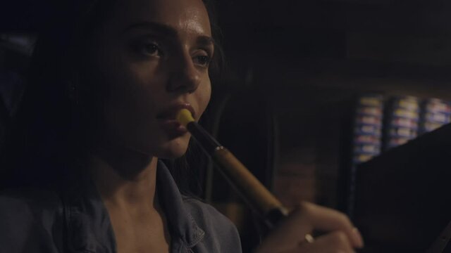 a girl smokes a hookah close-up
