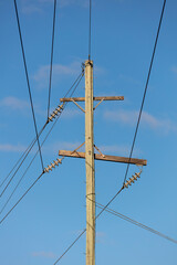 Photograph of a wooden telephone post and cables