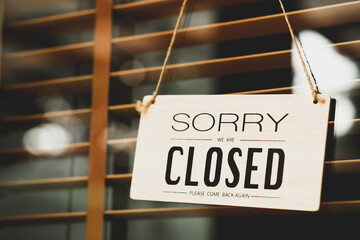 sorry closed sign on shop door. Text on cafe front or restaurant hang on door at entrance. vintage...