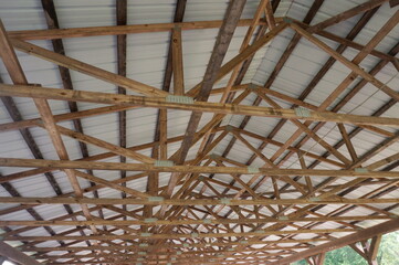 Wooden Rafters of Picknic Pavillion in Summer Time