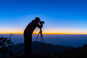 Photographer Landscape Nature Outdoor Hat. during mist sunrise , relax and freedom day. Lifestyle Concept.