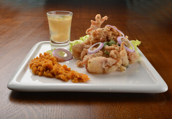 deep fried octopus seafood with lime juice appetiser on wood table fine dining western menu