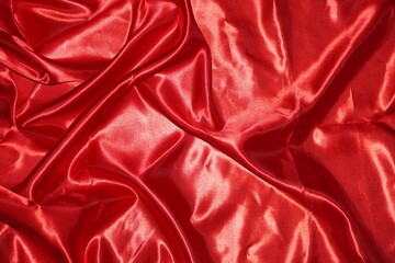 Obraz premium Smooth elegant red silk or satin luxury cloth texture can use as wedding background. Luxurious background design 