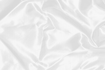 Smooth elegant white silk or satin luxury cloth texture can use as wedding background. Luxurious background design