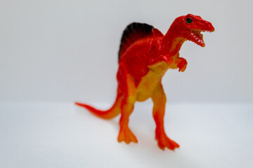 Red dinosaur. Huge and terrifying dinosaur. Kid toy.