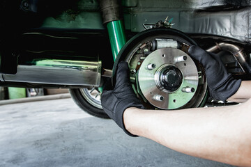 A man change Auto hub bearing  wheel of car for maintenance concept and tool for service