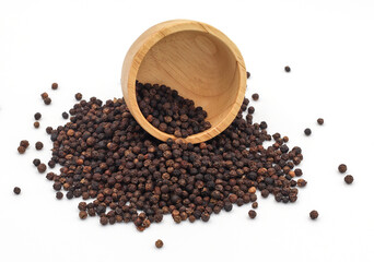 black pepper in a wooden bowl isolated on white background
