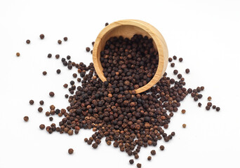 black pepper in a wooden bowl isolated on white background