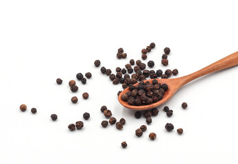 black pepper in a wooden bowl isolated on white background