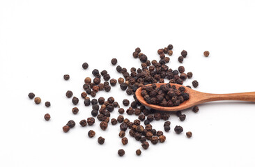 black pepper in a wooden bowl isolated on white background