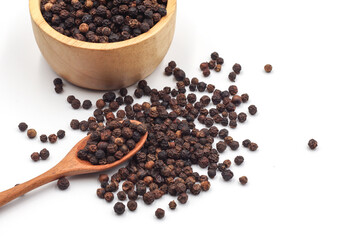 black pepper in a wooden bowl isolated on white background