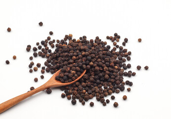 black pepper in a wooden bowl isolated on white background