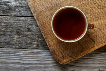 Cup of tea on an old wooden table