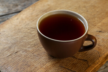Cup of tea on an old wooden table