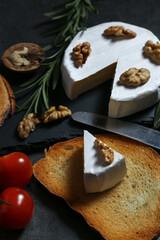 Still life with cheese on a dark background